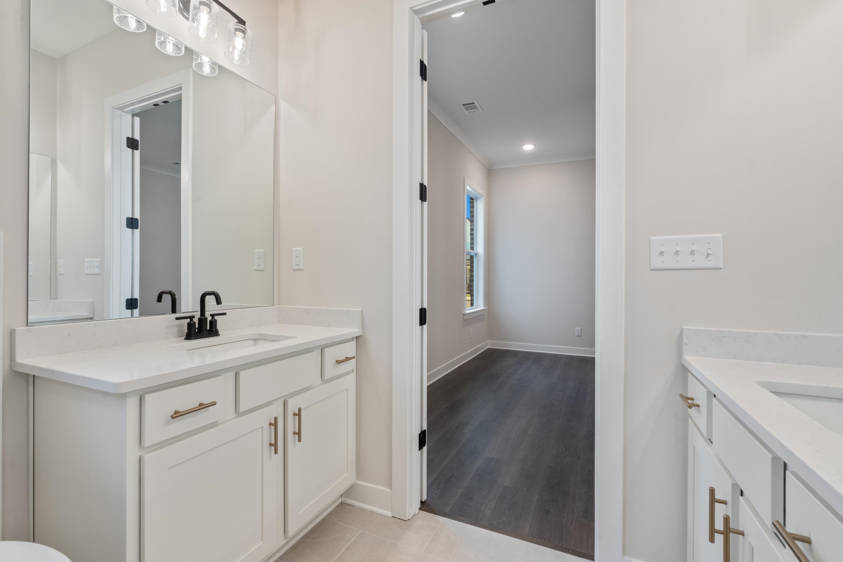 4844 Lyla Lane Collierville, TN 38017 - Photo 16 of 31 a view of a bathroom with a sink mirror and