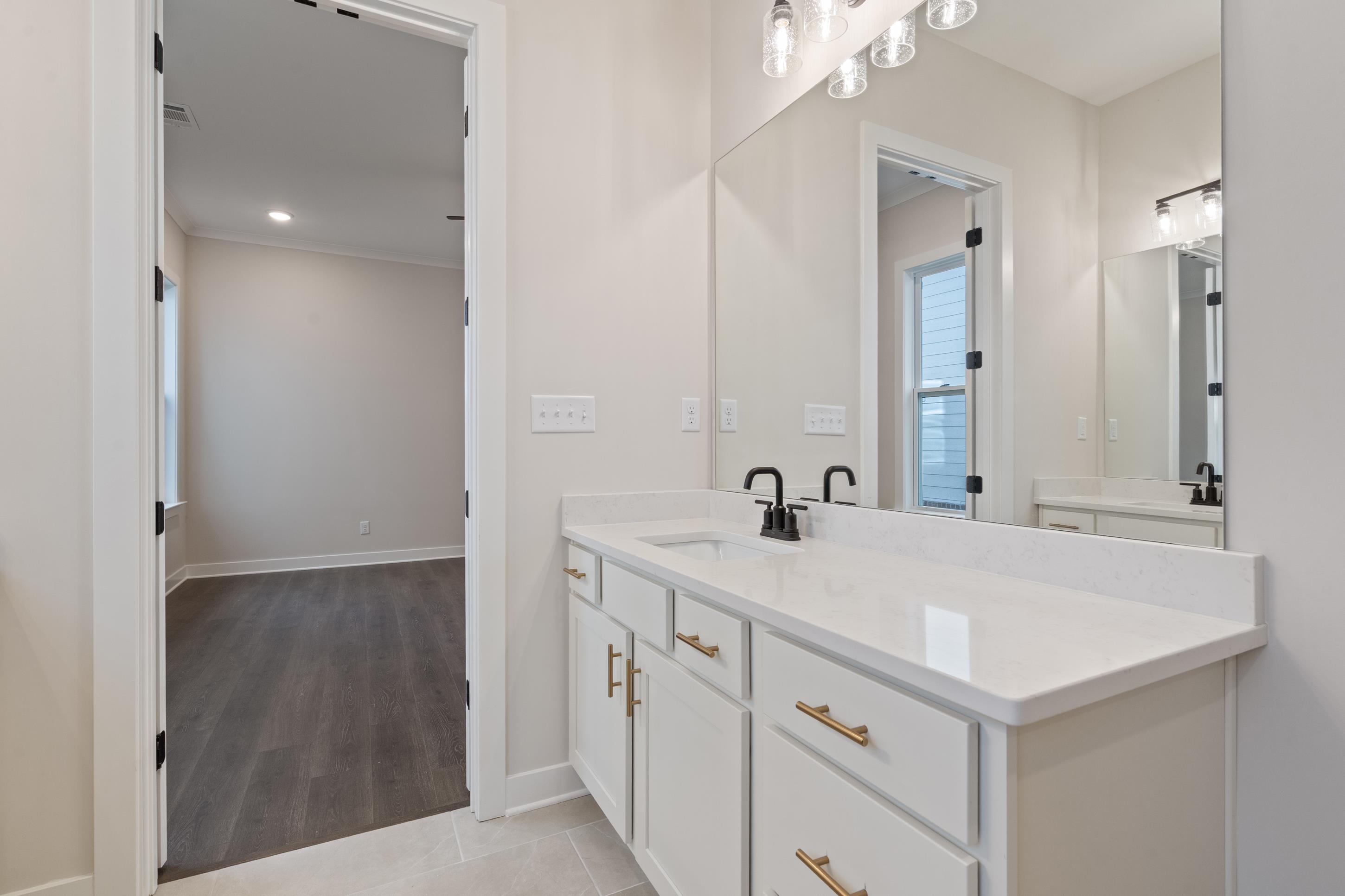 4844 Lyla Lane Collierville, TN 38017 - Photo 17 of 31 Bathroom featuring vanity, light tile patterned floors, and ornamental molding