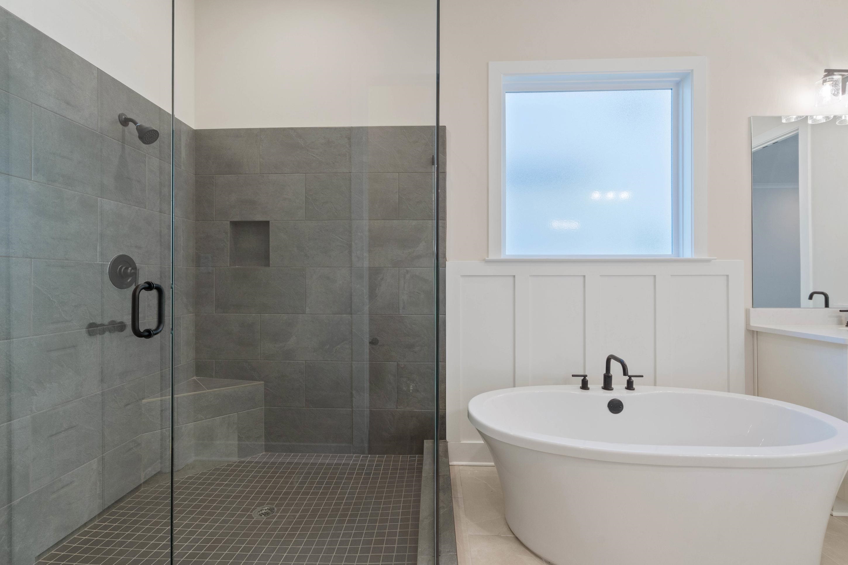 4844 Lyla Lane Collierville, TN 38017 - Photo 18 of 31 Full bath with a freestanding tub, a shower stall, vanity, and tile patterned floors