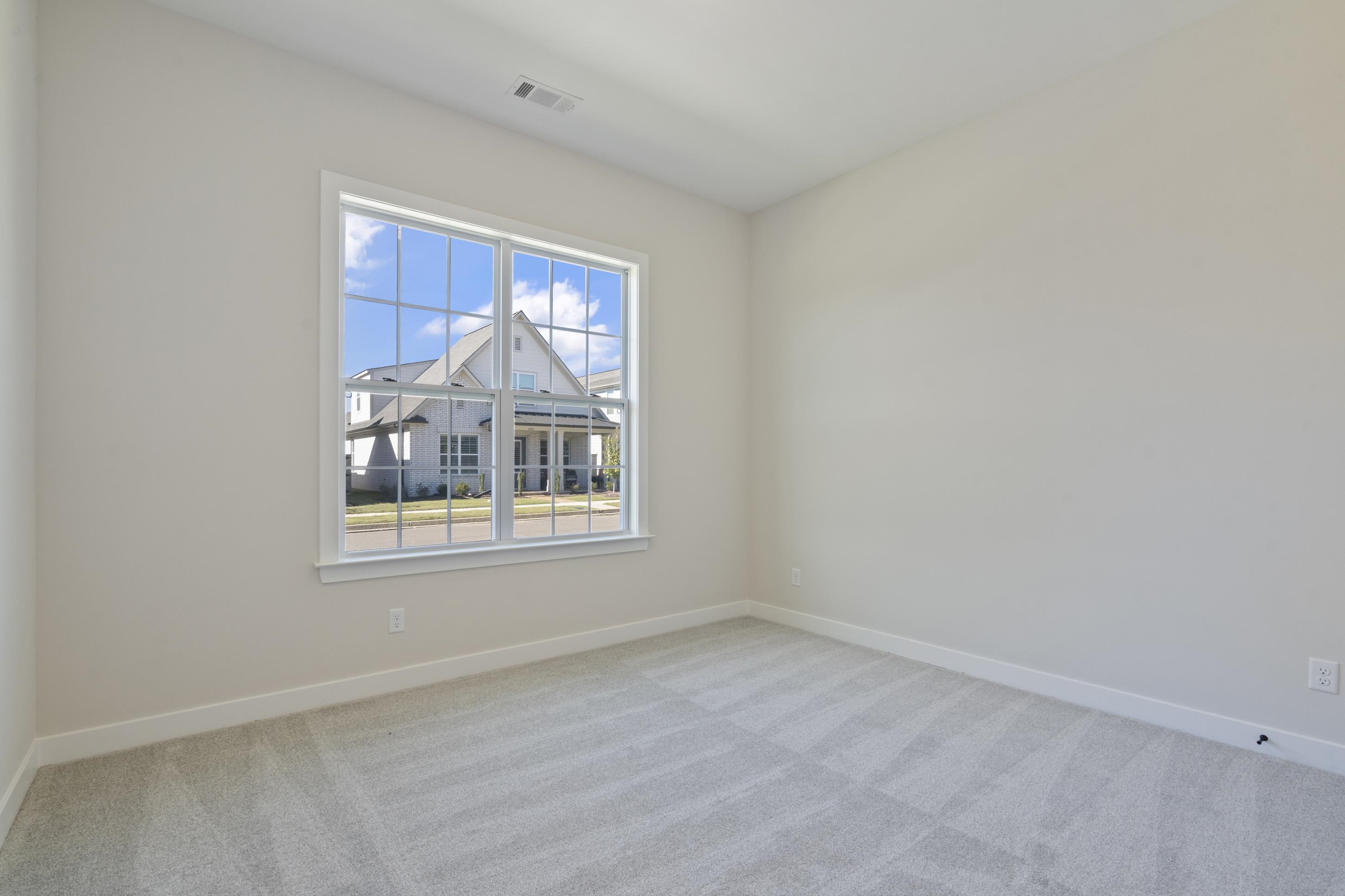 4844 Lyla Lane Collierville, TN 38017 - Photo 20 of 31 Empty room with light carpet and baseboards