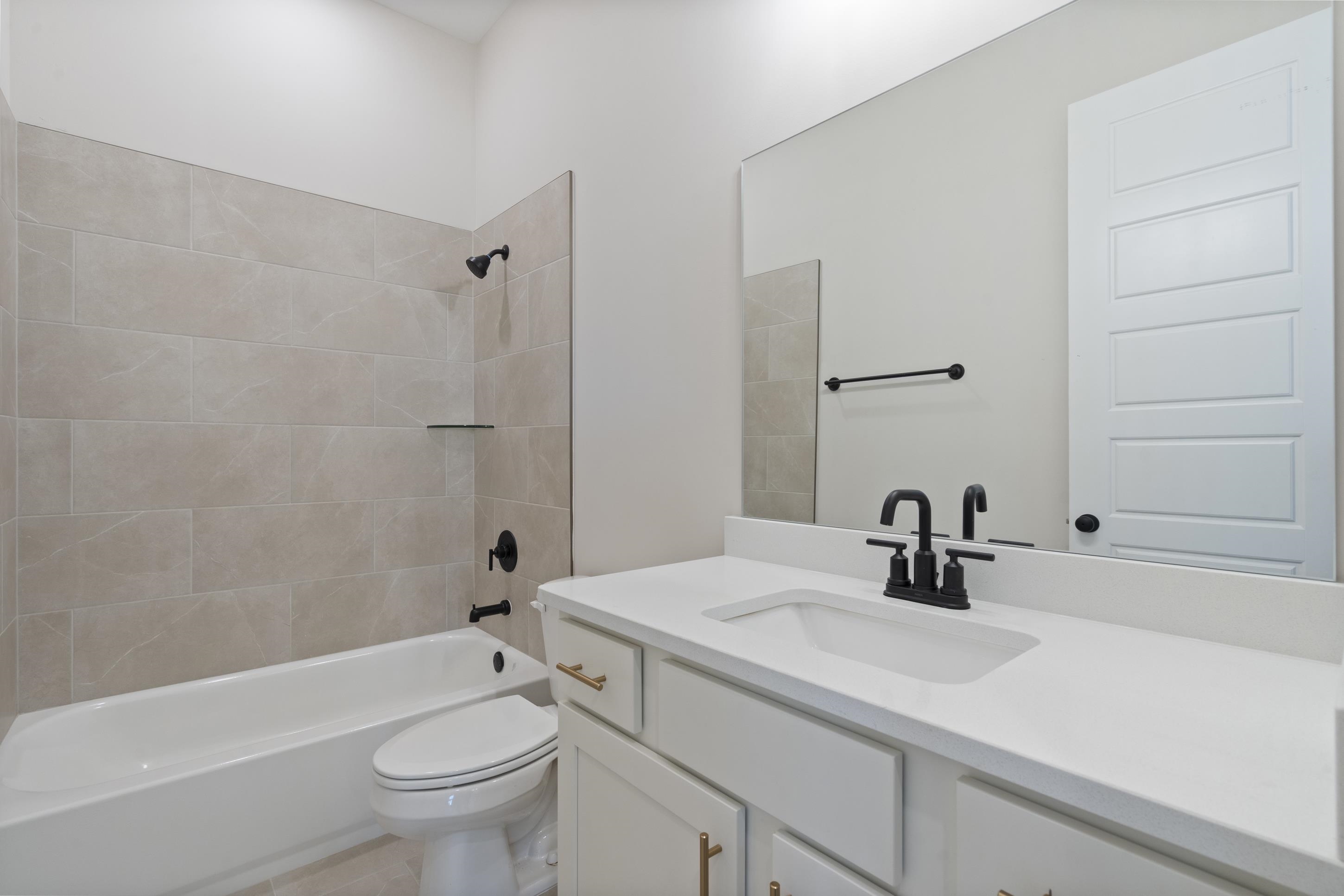 4844 Lyla Lane Collierville, TN 38017 - Photo 21 of 31 a bathroom with a sink a toilet and shower