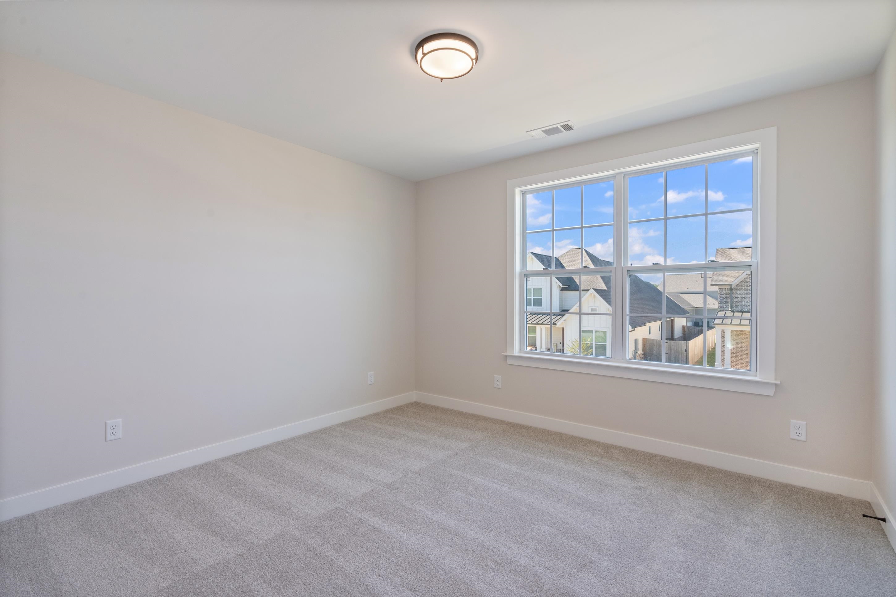 4844 Lyla Lane Collierville, TN 38017 - Photo 25 of 31 Spare room with baseboards and light carpet