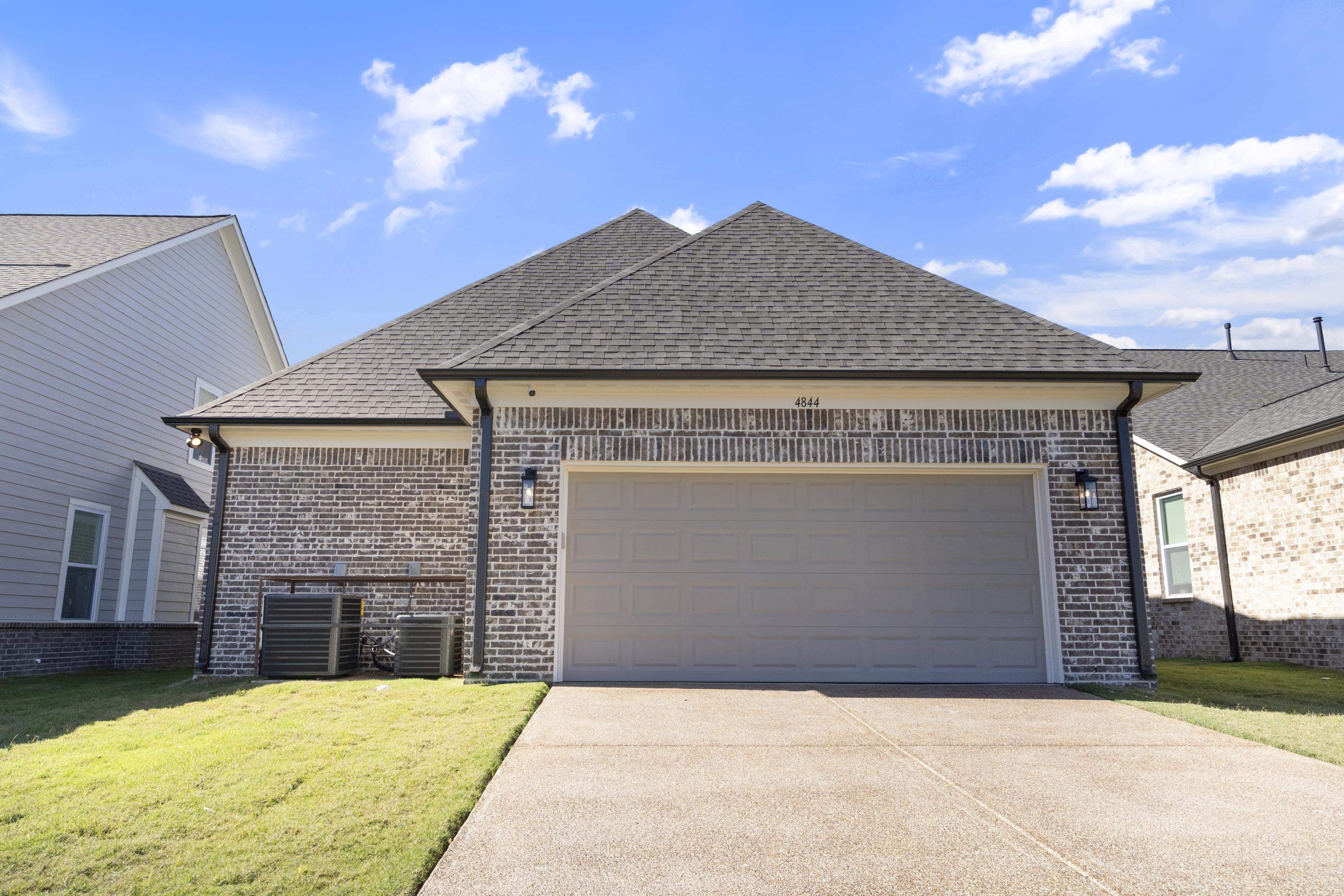4844 Lyla Lane Collierville, TN 38017 - Photo 29 of 31 a front view of a house with a yard