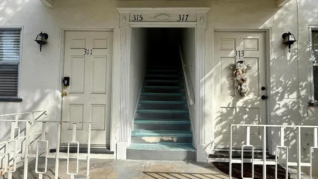 a view of a balcony with wooden floor
