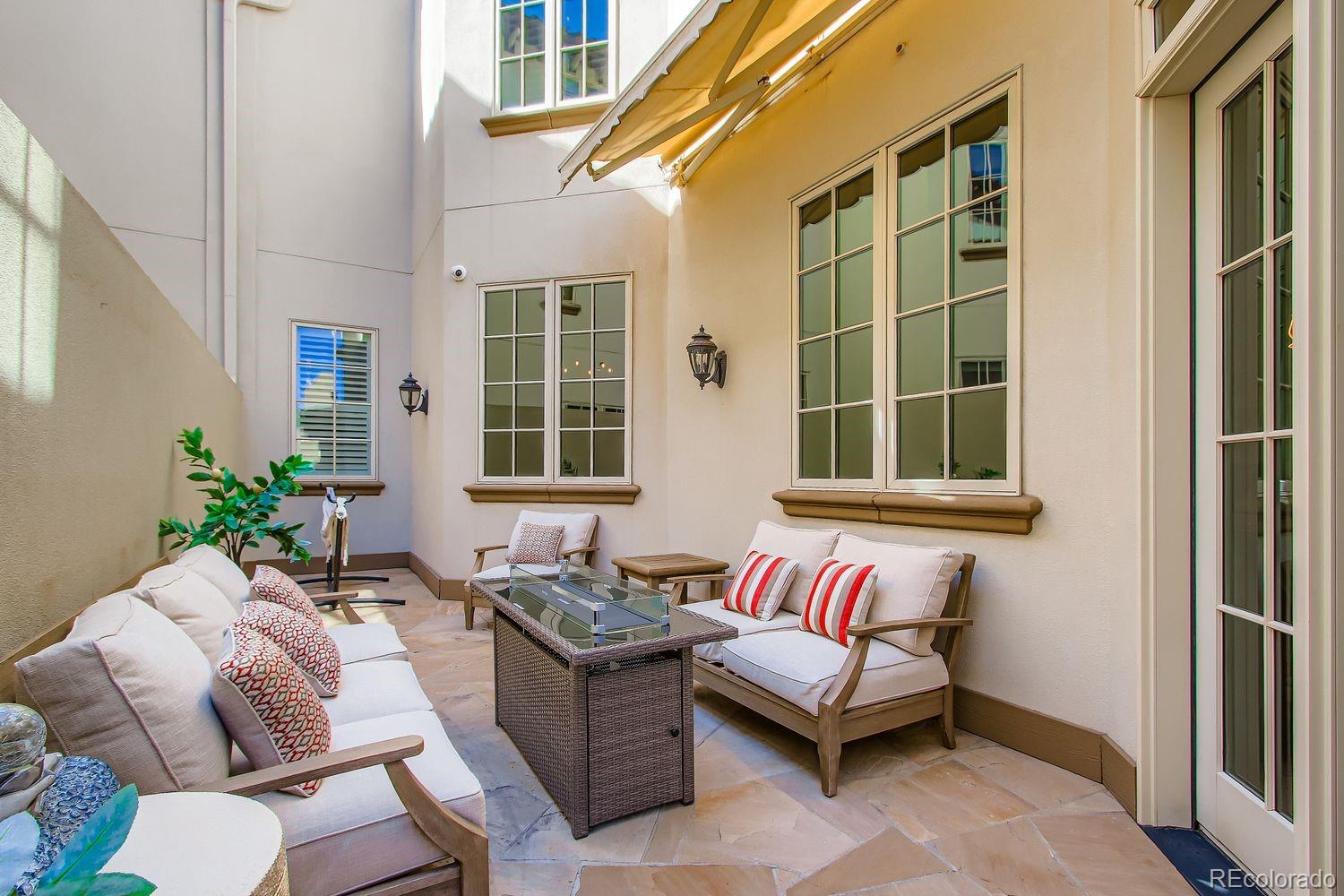 450 Detroit Street Denver, CO 80206 - Photo 11 of 28 a outdoor living space with furniture and a window