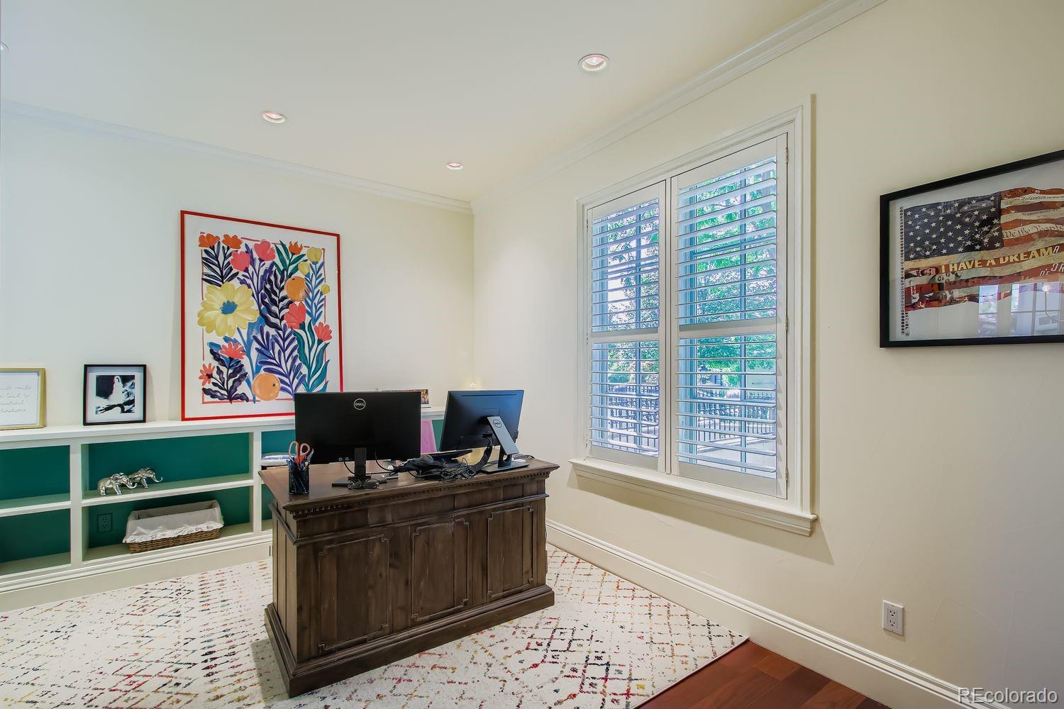 450 Detroit Street Denver, CO 80206 - Photo 12 of 28 a living room with furniture window and a flat screen tv
