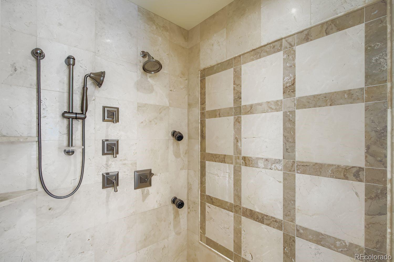 450 Detroit Street Denver, CO 80206 - Photo 17 of 28 a bathroom with a shower