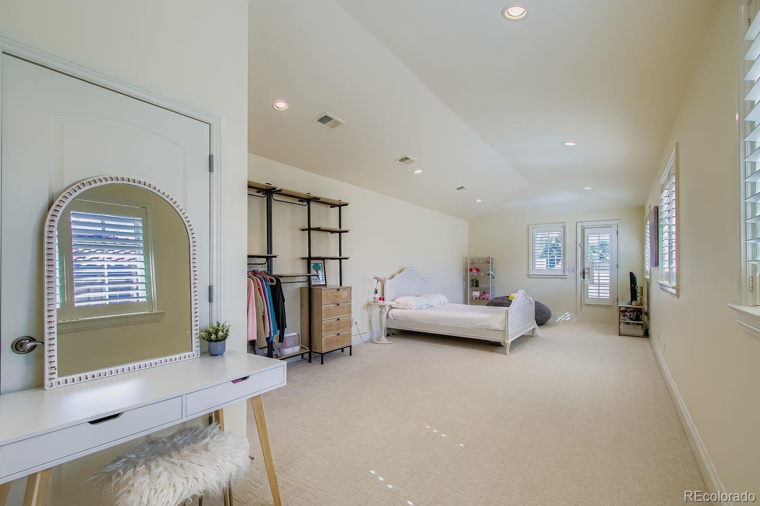450 Detroit Street Denver, CO 80206 - Photo 20 of 28 a living room with furniture and a window