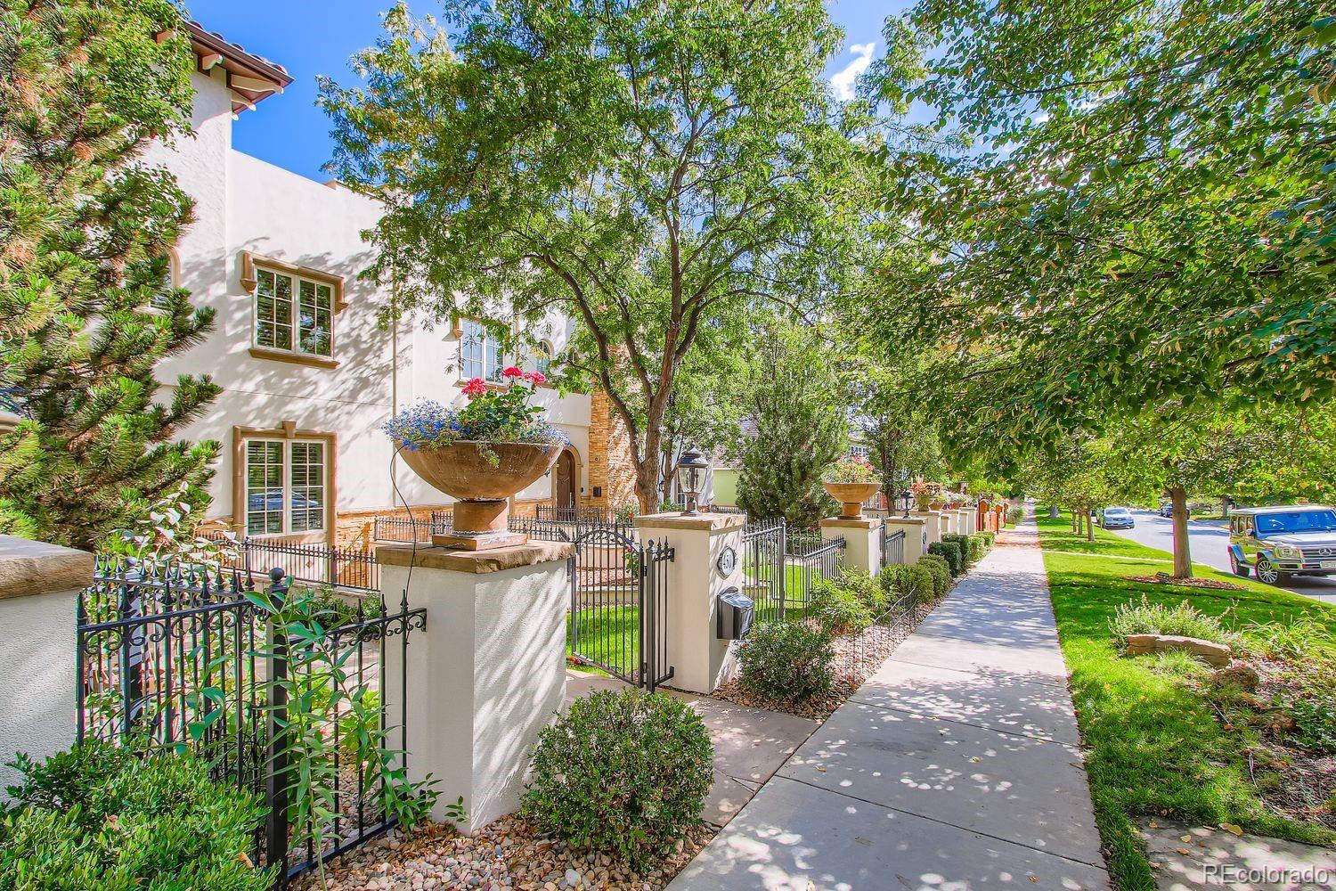 450 Detroit Street Denver, CO 80206 - Photo 2 of 28 a front view of a house with a garden and plants