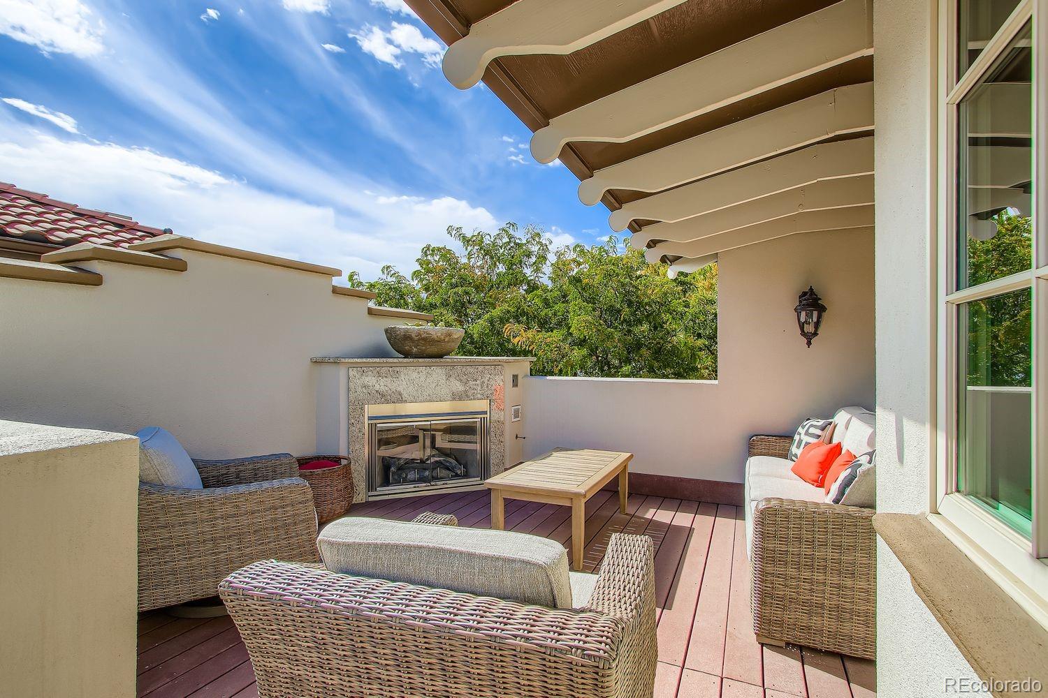 450 Detroit Street Denver, CO 80206 - Photo 22 of 28 a living room with furniture and a fireplace
