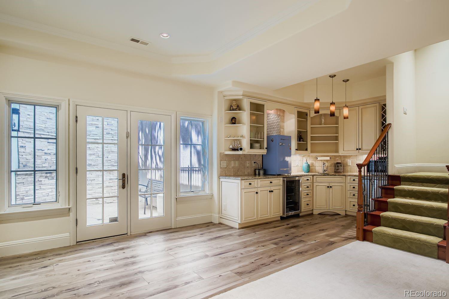 450 Detroit Street Denver, CO 80206 - Photo 24 of 28 a view of a living room with furniture and wooden floor