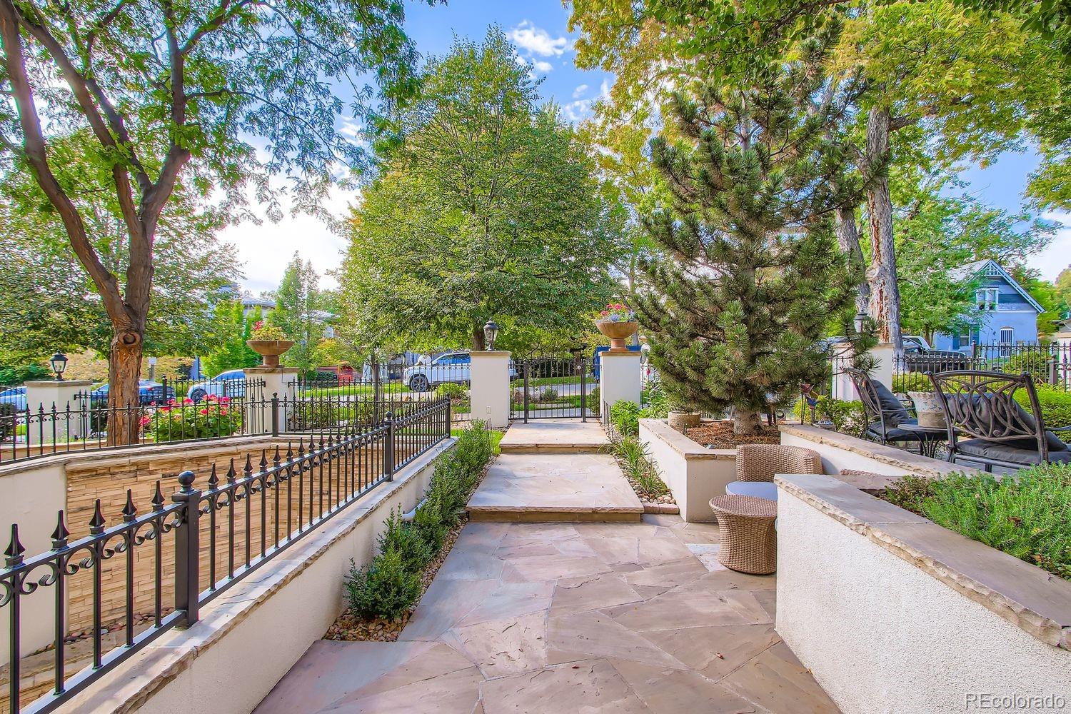 450 Detroit Street Denver, CO 80206 - Photo 4 of 28 a view of a house with large trees