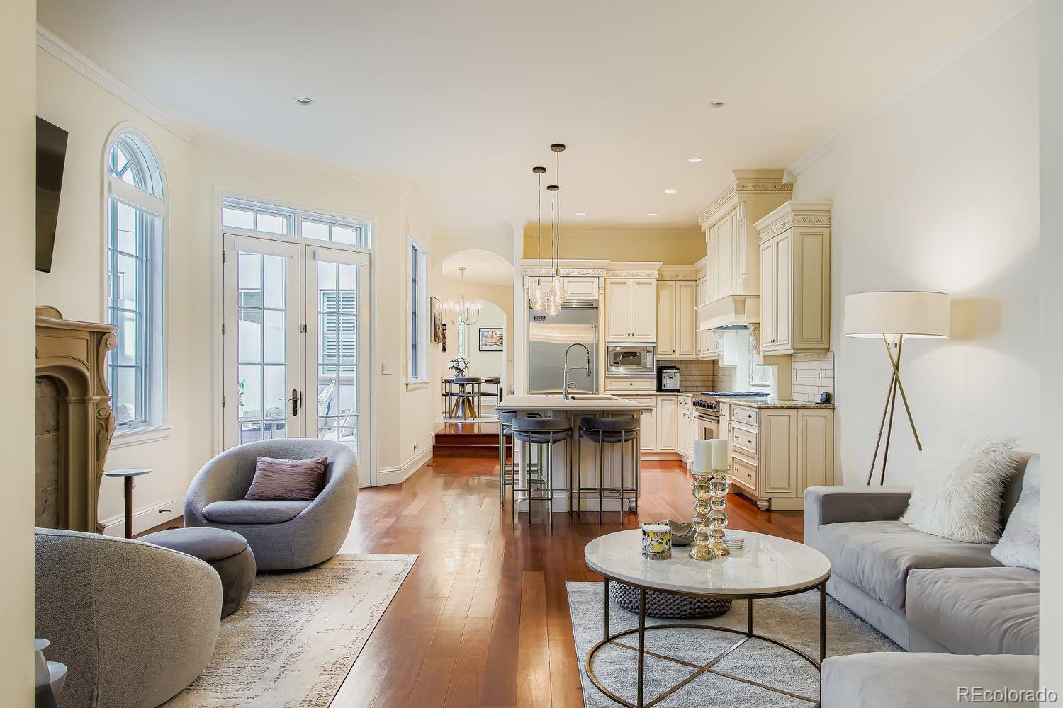 450 Detroit Street Denver, CO 80206 - Photo 8 of 28 a living room with furniture and a large window