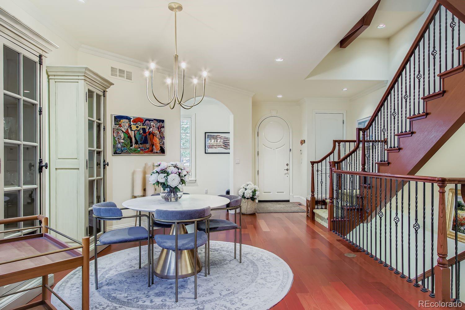 450 Detroit Street Denver, CO 80206 - Photo 10 of 28 a view of a dining room with furniture a rug and wooden floor