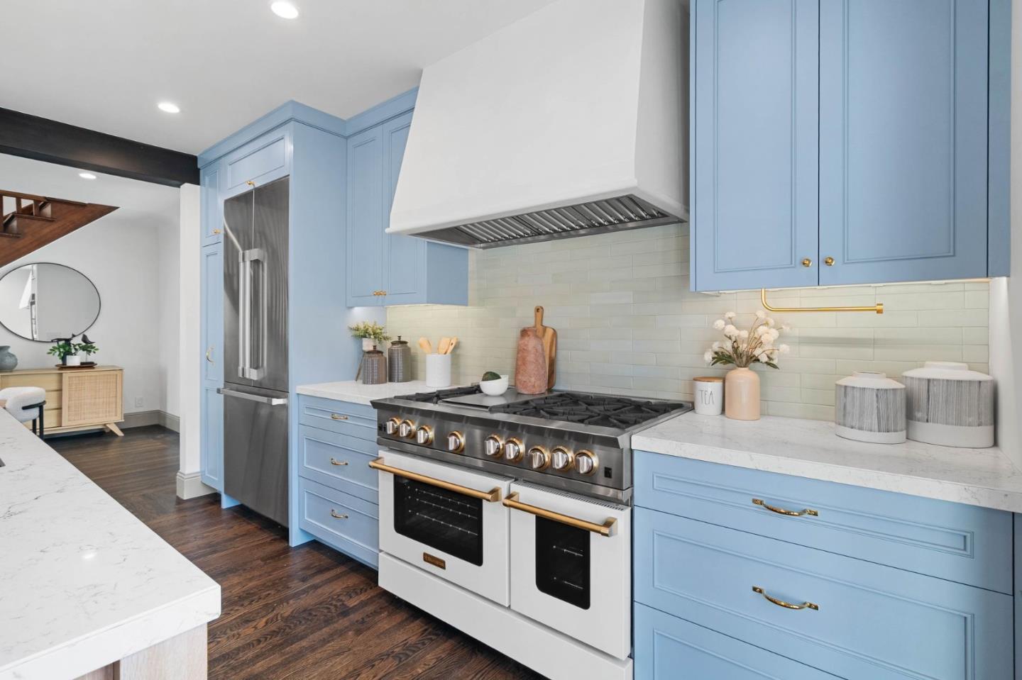 58 Gladys Avenue Mountain View, CA 94043 - Photo 14 of 42 a kitchen with stainless steel appliances a stove and white cabinets
