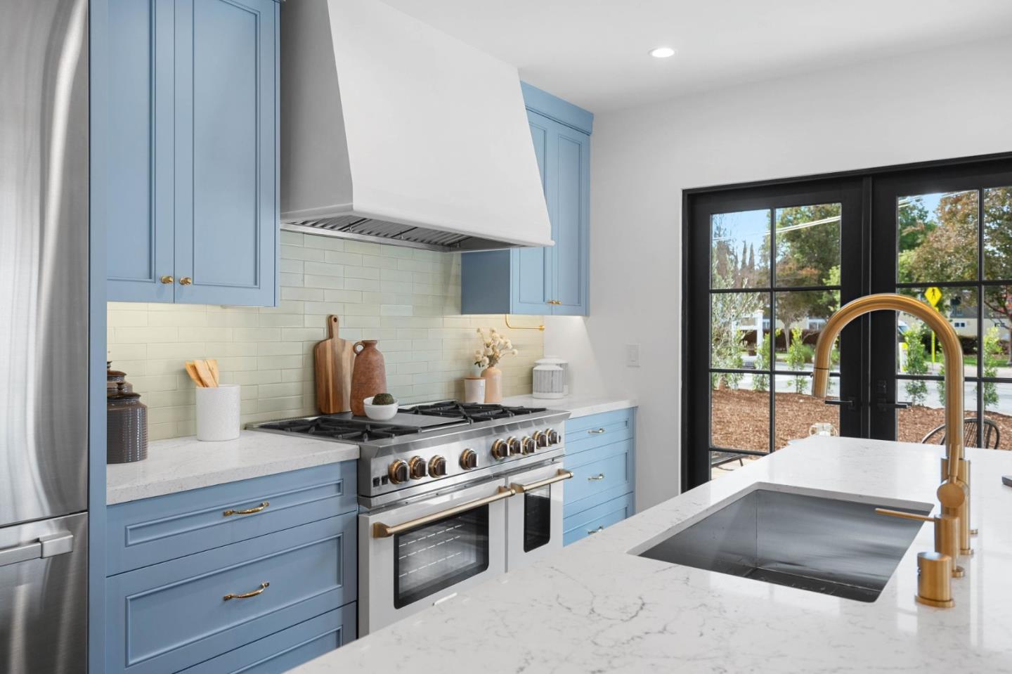58 Gladys Avenue Mountain View, CA 94043 - Photo 15 of 42 a kitchen with granite countertop a stove and a sink