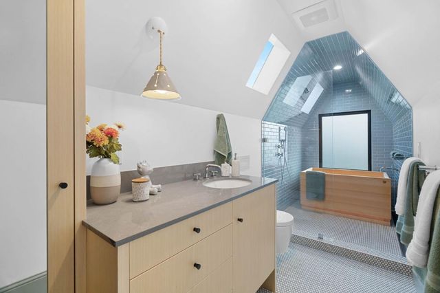 a bathroom with a sink a vanity and mirror