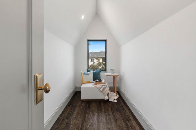 a room with a window and a wooden floor