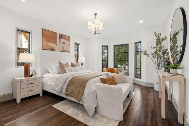 a bedroom with bed and window