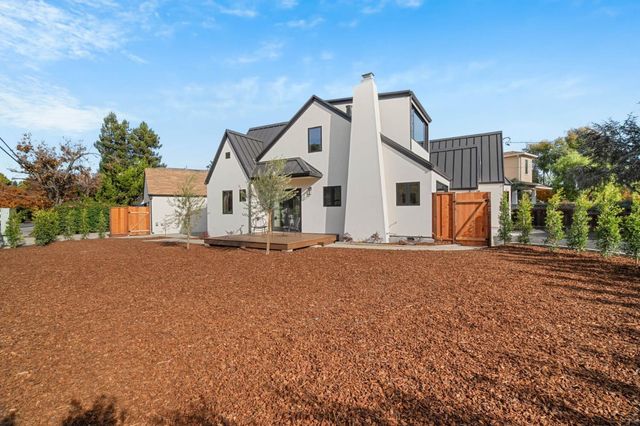 a view of a house with a yard and garage