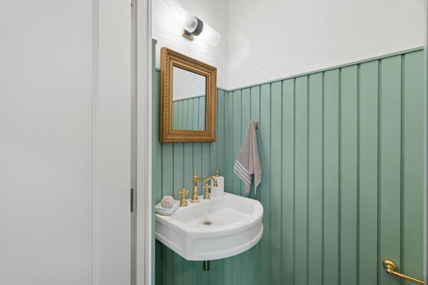 58 Gladys Avenue Mountain View, CA 94043 - Photo 9 of 42 a bathroom with a sink a mirror and a window