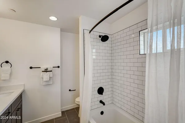 a bathroom with a bathtub and shower