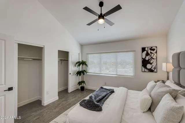 a bed room with a bed and a window