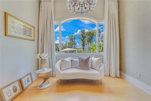 a kitchen with stainless steel appliances granite countertop a stove and a bookshelf