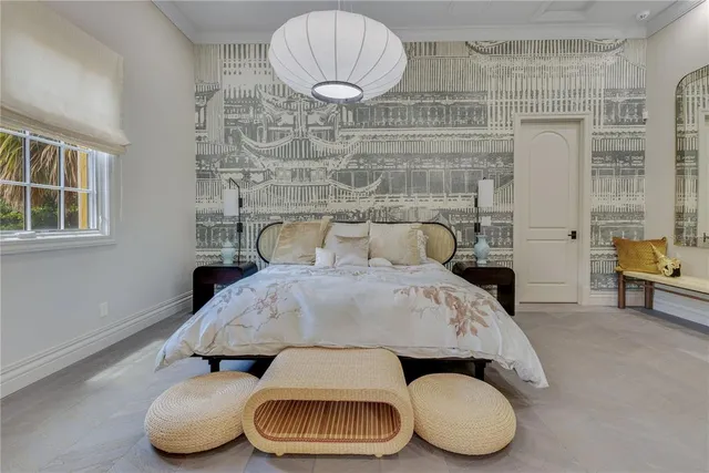 a front view of a house with a garden and yard