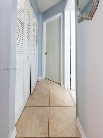 a view of a room with a sink and painted walls