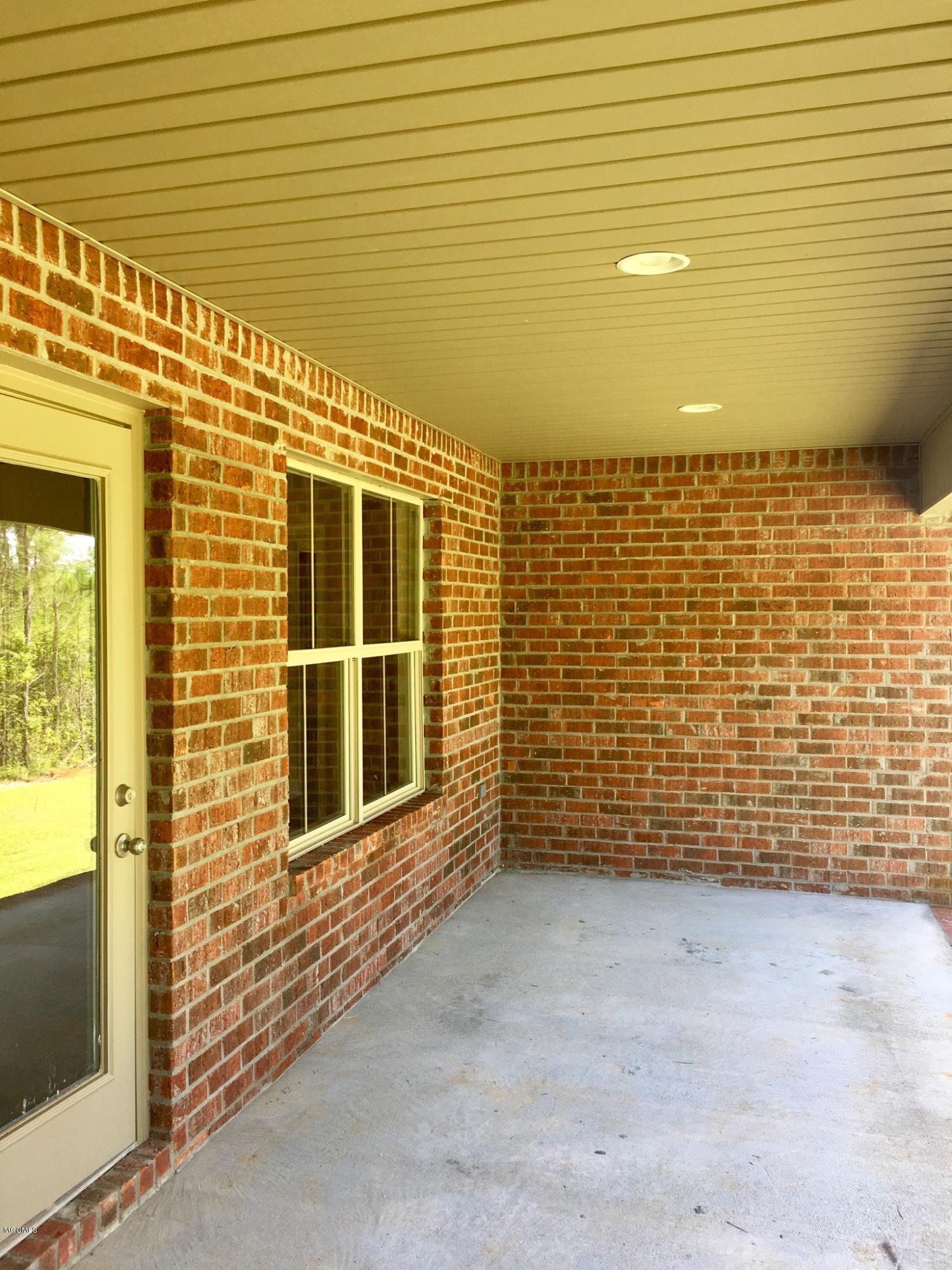 6869 Biddix Evans Road Ocean Springs, MS 39564 - Photo 7 of 34 Large covered back porch