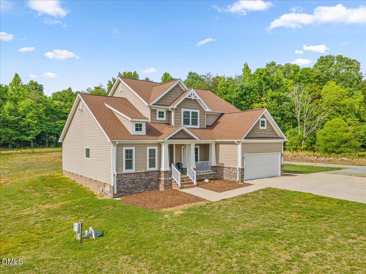 704 Haw River Hopedale Road Burlington, NC 27217 - Photo 2 of 49 a front view of a house with garden