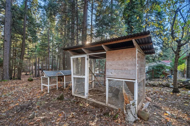 a backyard of a house with table and chairs