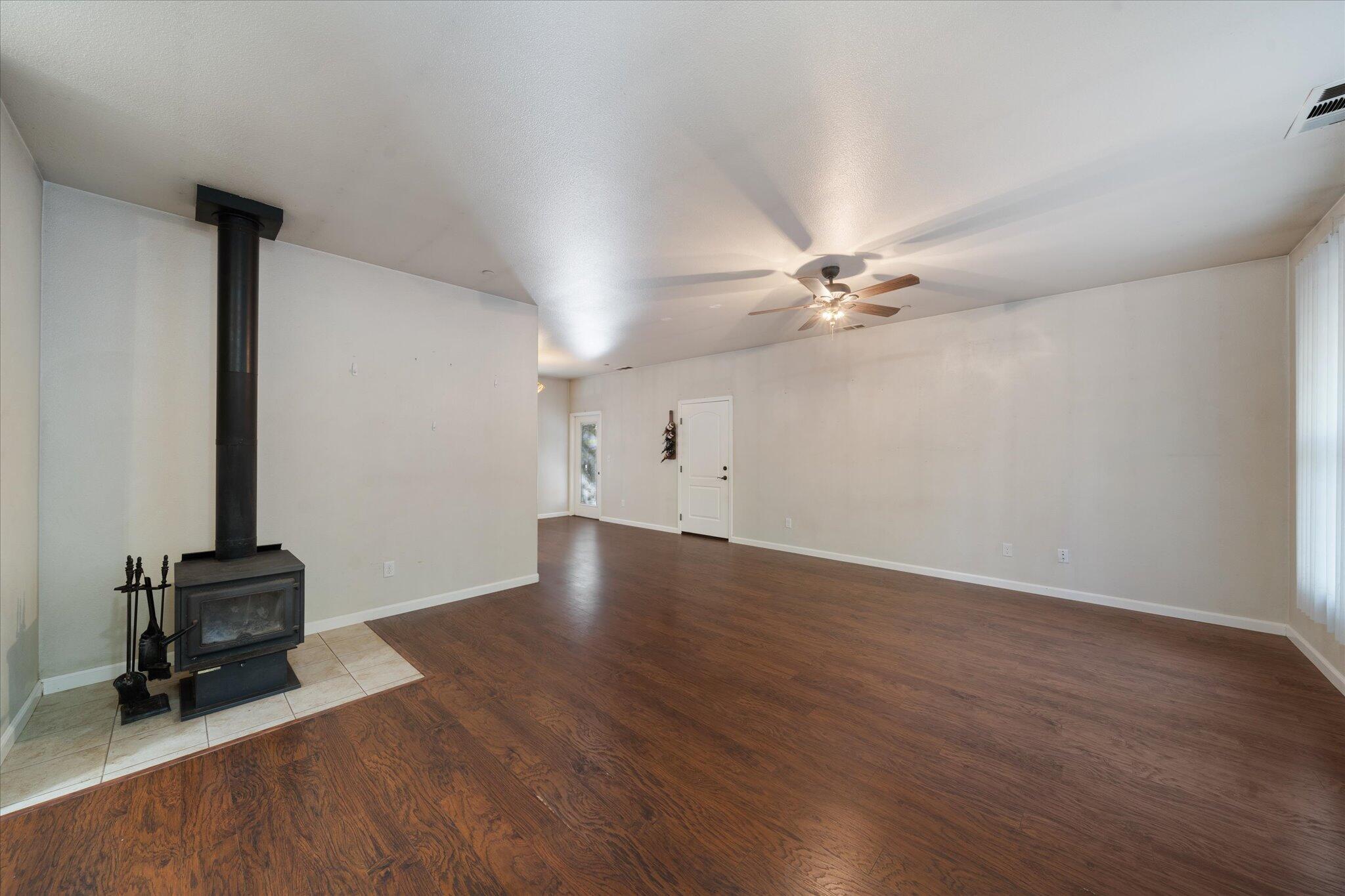 30821 Tinkerbell Lane Shingletown, CA 96088 - Photo 5 of 25 wooden floor in an empty room with a window