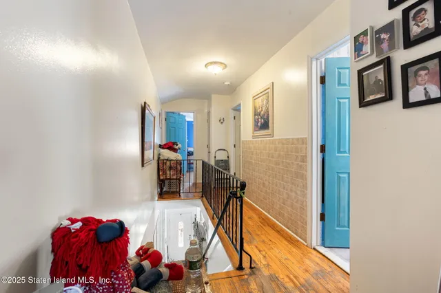 a bed room with a bed window and a ceiling fan