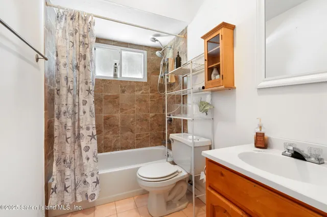 a living room with furniture a air conditioner and a rug