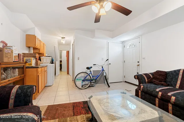 a view of a backyard with sitting area