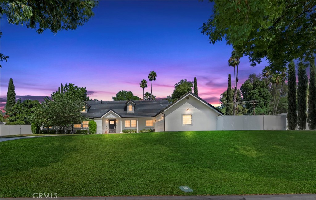 7398 Whitegate Avenue Riverside, CA 92506 - Photo 1 of 51 a front view of a house with garden