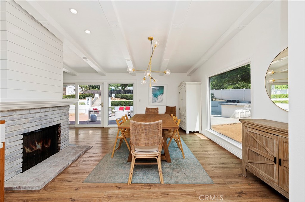 7398 Whitegate Avenue Riverside, CA 92506 - Photo 18 of 51 a living room with furniture a window and a fireplace