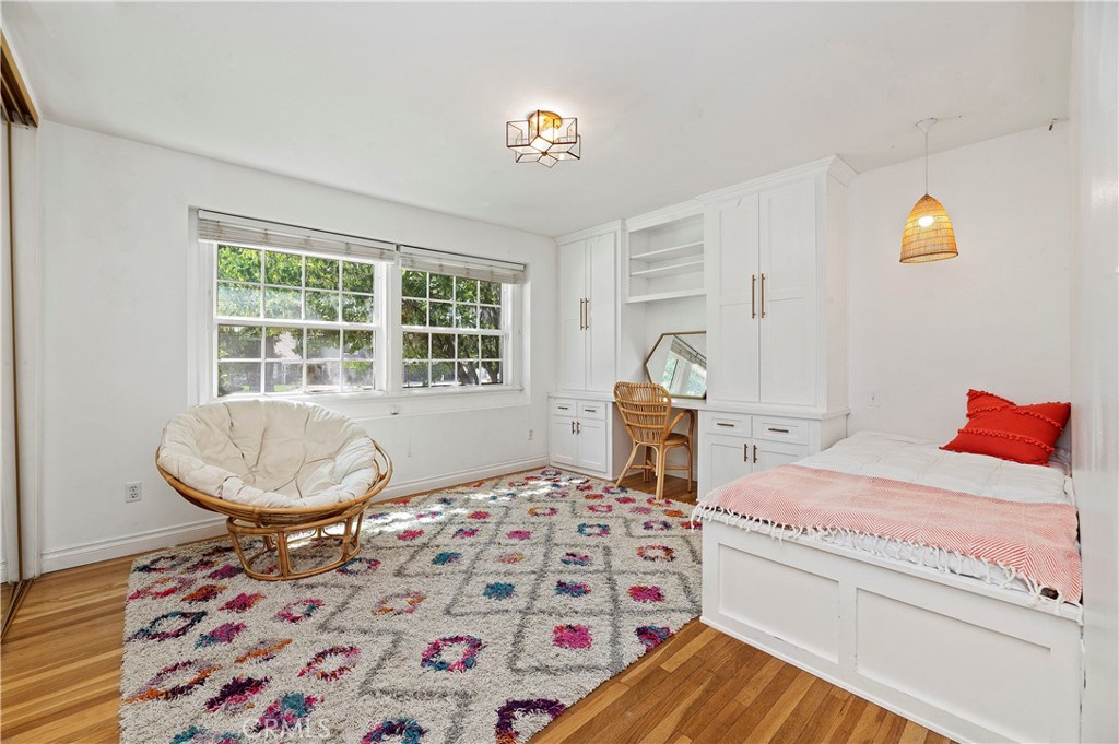 7398 Whitegate Avenue Riverside, CA 92506 - Photo 22 of 51 a bedroom with bed and a window