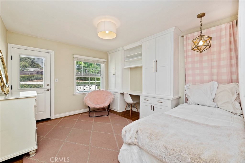 7398 Whitegate Avenue Riverside, CA 92506 - Photo 23 of 51 a spacious bedroom with a bed and window