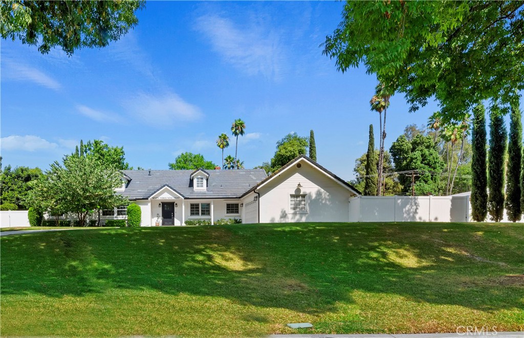 7398 Whitegate Avenue Riverside, CA 92506 - Photo 3 of 51 a view of a house with a yard