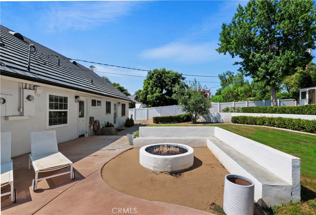 7398 Whitegate Avenue Riverside, CA 92506 - Photo 37 of 51 a swimming pool with outdoor seating and yard