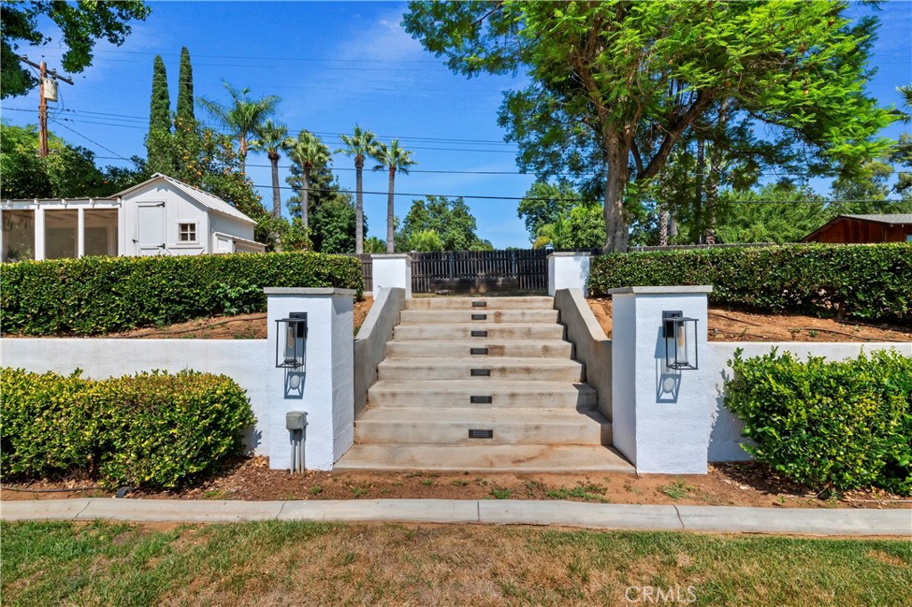 7398 Whitegate Avenue Riverside, CA 92506 - Photo 41 of 51 a view of house with yard and green space