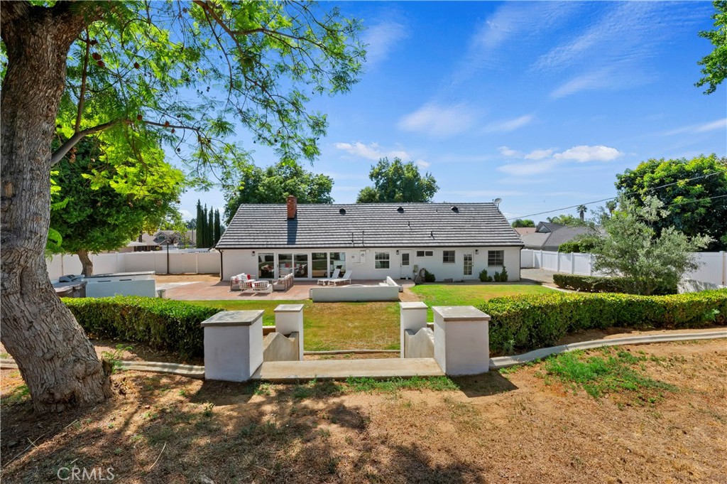7398 Whitegate Avenue Riverside, CA 92506 - Photo 42 of 51 a view of a house with garden and a sitting area