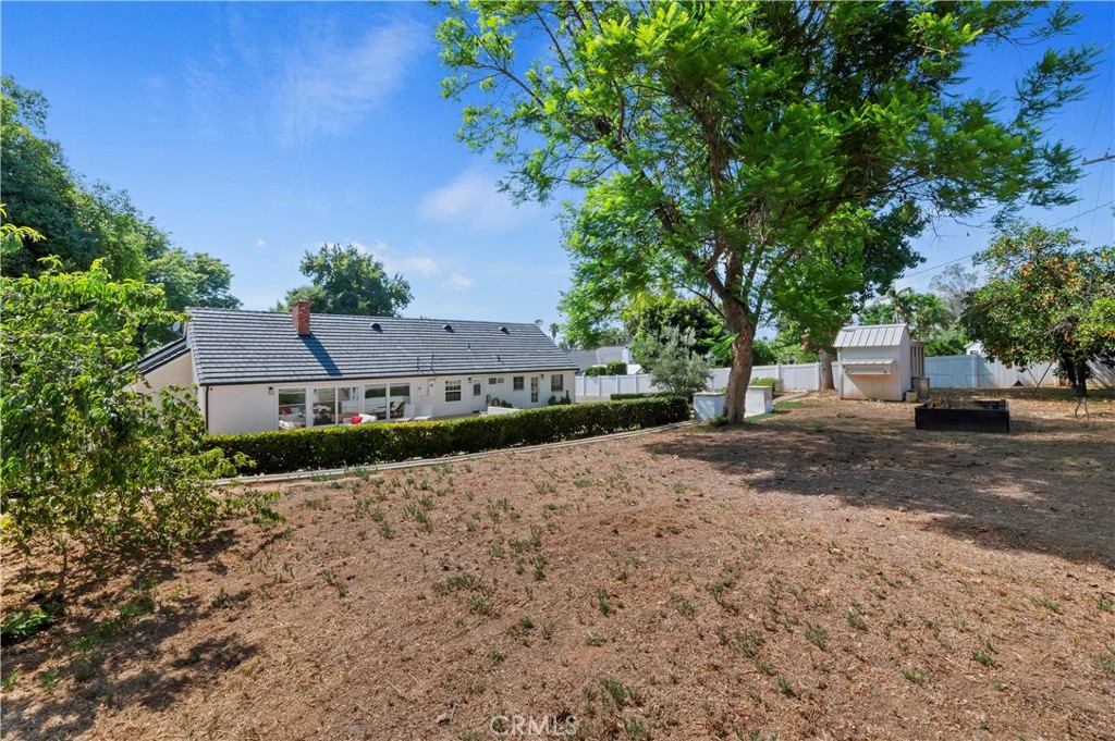 7398 Whitegate Avenue Riverside, CA 92506 - Photo 45 of 51 a view of a house with a tree and plants