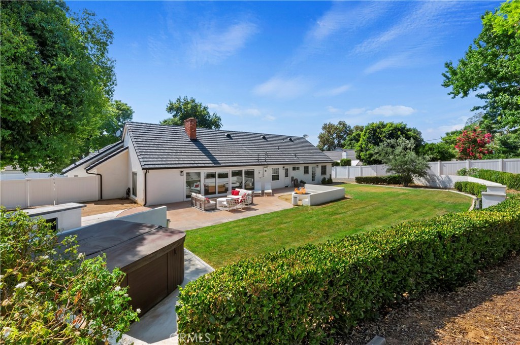 7398 Whitegate Avenue Riverside, CA 92506 - Photo 47 of 51 a view of a house with garden and a trees