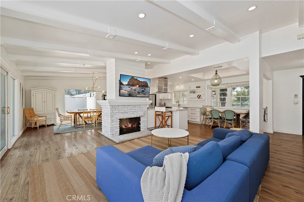 7398 Whitegate Avenue Riverside, CA 92506 - Photo 8 of 51 a living room with furniture and a fireplace