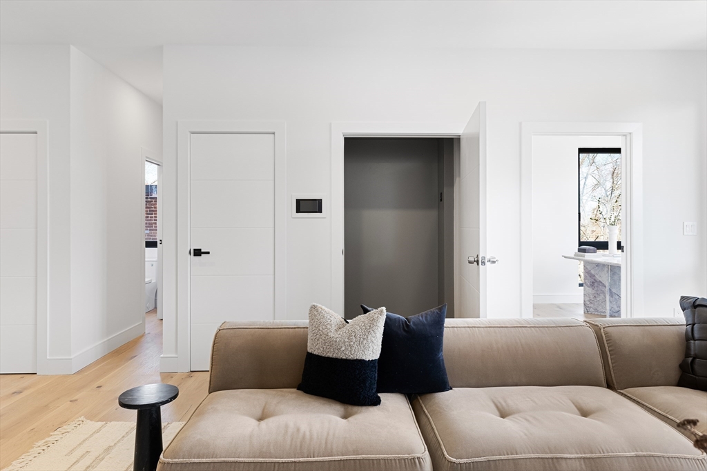 41 University Road, Unit 2 Brookline, MA 02445 - Photo 13 of 33 a living room with furniture and a couch