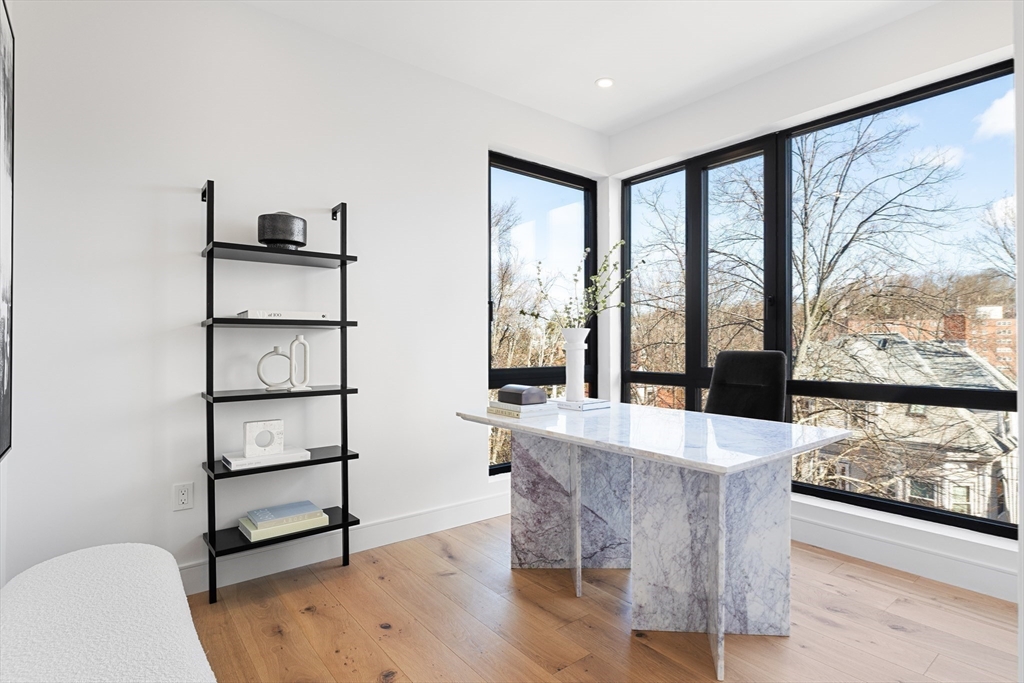 41 University Road, Unit 2 Brookline, MA 02445 - Photo 15 of 33 a living room with furniture a large window and wooden floor